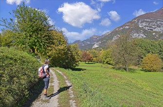 Hiker in the autumnal Ledro Valley