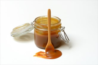 French caramel cream in glass with spoon