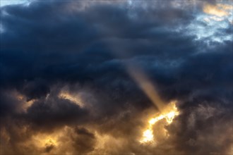 Sunbeam through gap in clouds