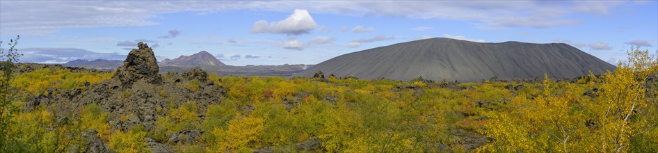 Tuff ring Hverfjall and lava formation of Dimmuborgir with autumn coloured birch vegetation