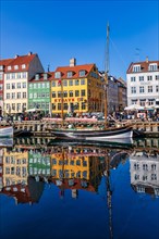 Colored houses and sailing boats on Nyhavn Canal
