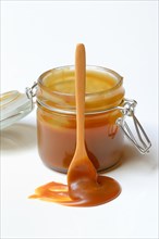 French caramel cream in glass with spoon