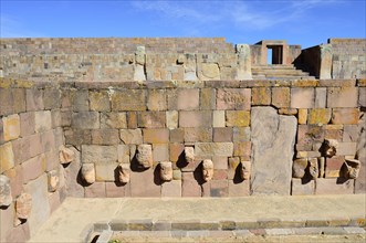 Sunken courtyard with head reliefs