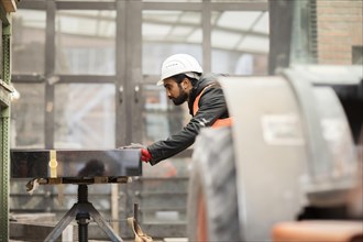 Technician with beard and helmet