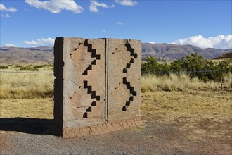 Stone block with Andean cross symbol