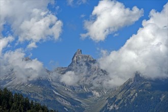 Clouds wreathe the Petit Muveran summit