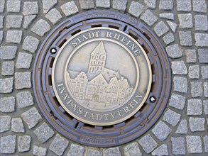 Manhole cover with relief City of Rheine
