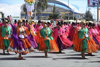 Dance group in traditional costumes at a parade