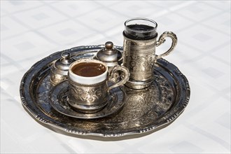Cup of Turkish coffee with water