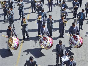 Music group with timpani and trumpets during a parade