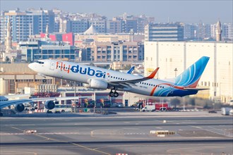 A FlyDubai Boeing 737-800 aircraft with registration A6-FEG takes off from Dubai Airport