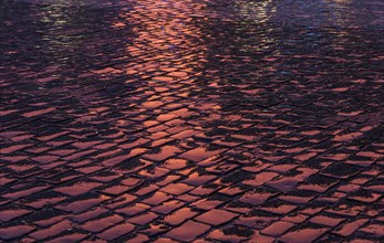 Wet and reflective cobblestones