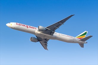 A Boeing 777-300ER aircraft of Ethiopian Airlines with registration number ET-APX takes off from Dubai Airport