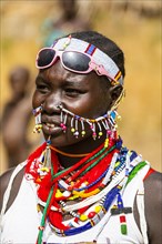 Traditional dressed young girl from the Laarim tribe