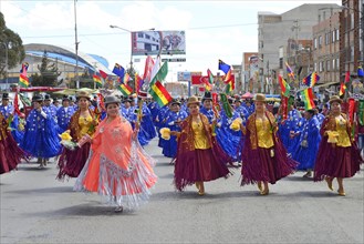 Dance group in traditional costumes at a parade
