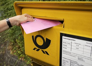 Election letter is put into Deutsche Post letterbox