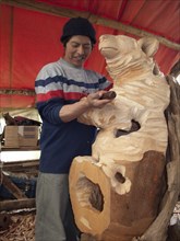 Sculptor carving bear sculpture