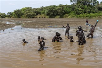 Children playing in the river bed