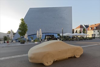 Concrete sculpture Porsche 911 by Gottfried Bechthold in front of the Landesgalerie Niederoesterreich