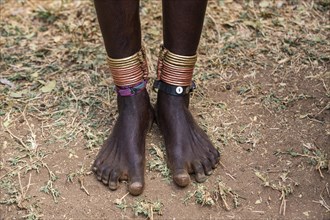Close up from foot rings on the legs from a girl of the Laarim tribe