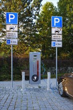 Vehicle charging electricity at electric vehicle charging station