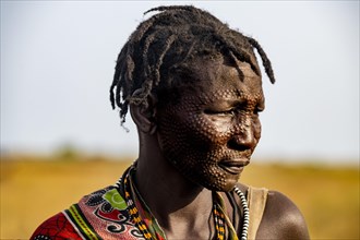Scar face as a mark of beauty man from the Jiye tribe