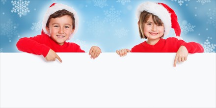 Christmas children Father Christmas laugh show sign text free space copyspace young