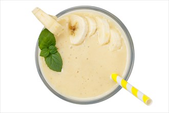 Banana smoothie fruit juice drink juice in glass from above exempted isolated