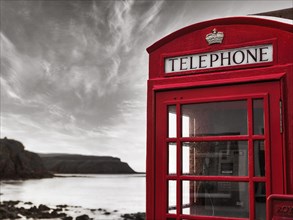 Red telephone box on the coast