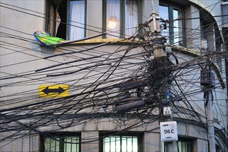 Tangled cables on a power pole in the centre