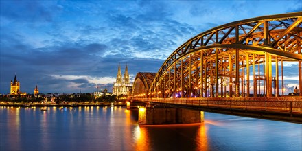 Cologne Cathedral Skyline and Hohenzollern Bridge with River Rhine Panorama in Germany by Night in Cologne