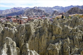 Homes behind the bizarre rock formations in the Valle de la Luna