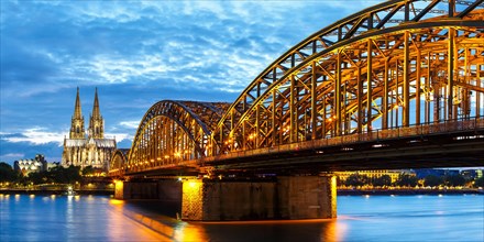 Cologne Cathedral Skyline and Hohenzollern Bridge with River Rhine in Germany by Night Panorama in Cologne