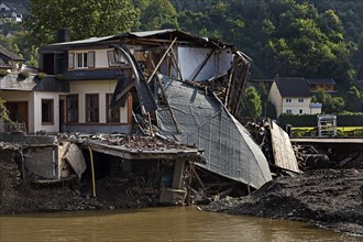 Destroyed house at the Nepomuk bridge with the river Ahr