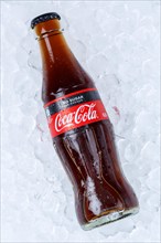 Coca Cola Coca-Cola Coke Zero Sugar in a bottle lemonade soft drink drink on ice cube ice cubes