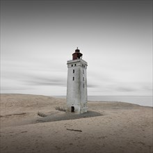 Lighthouse in the Rubjerg Knude shifting sand dune