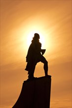 Statue of Leif Eriksson in the backlight
