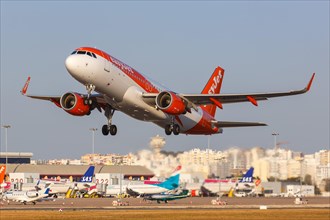 An EasyJet Airbus A320 with registration G-EZOU at Faro Airport