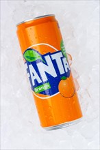Fanta Orange Lemonade soft drink beverage in a can on ice cube ice cubes