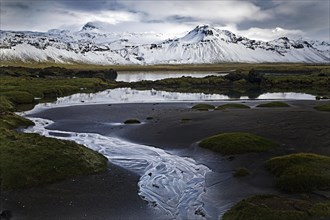 Mountain panorama with snow at low tide