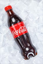 Coca Cola Coca-Cola in plastic bottle lemonade soft drink drink on ice cube ice cubes