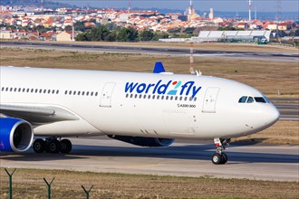 A World2Fly Airbus A330-300 with registration EC-LXR and Tudo Azul special livery at Lisbon Airport