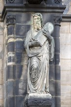 Sculpture of Moses with tablets of the law on the facade of St. Peter's Cathedral