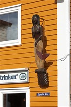 Figure of a mermaid at a lobster stand