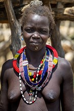 Friendly traditional dressed girl from the Toposa tribe