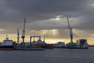 Blohm + Voss shipyard in the morning backlight