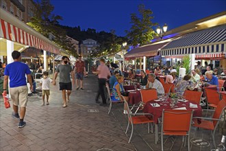 Evening hustle and bustle with restaurants and market stalls on the Cours Saleya