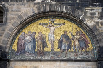 Mosaic depicting the crucifixion of Jesus above the portal of St. Peter's Cathedral