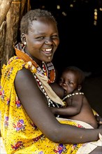 Woman from the Toposa tribe breastfeeding her baby
