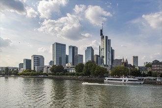 Frankfurt skyline with excursion steamer and jet scooter on the Main